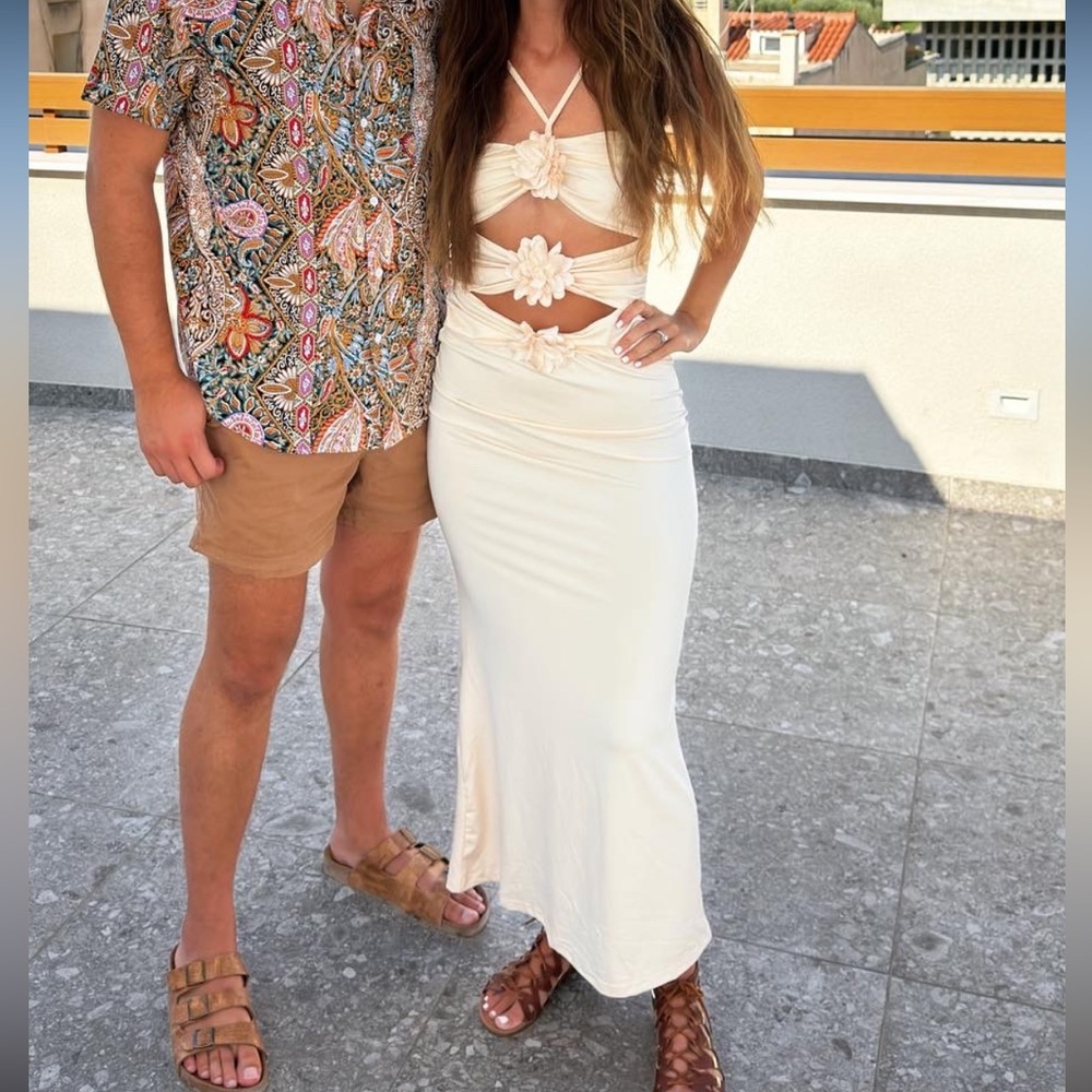 Tan / apricot colored dress with cutouts and flowers / florals